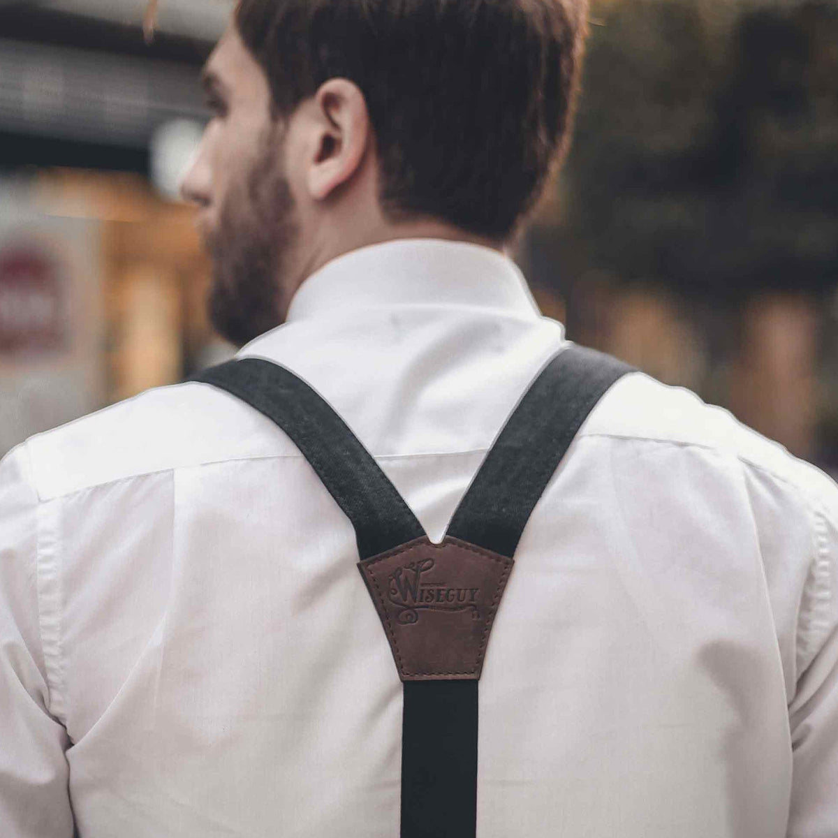 Man wearing Black Wiseguy Duck Suspenders over a white shirt