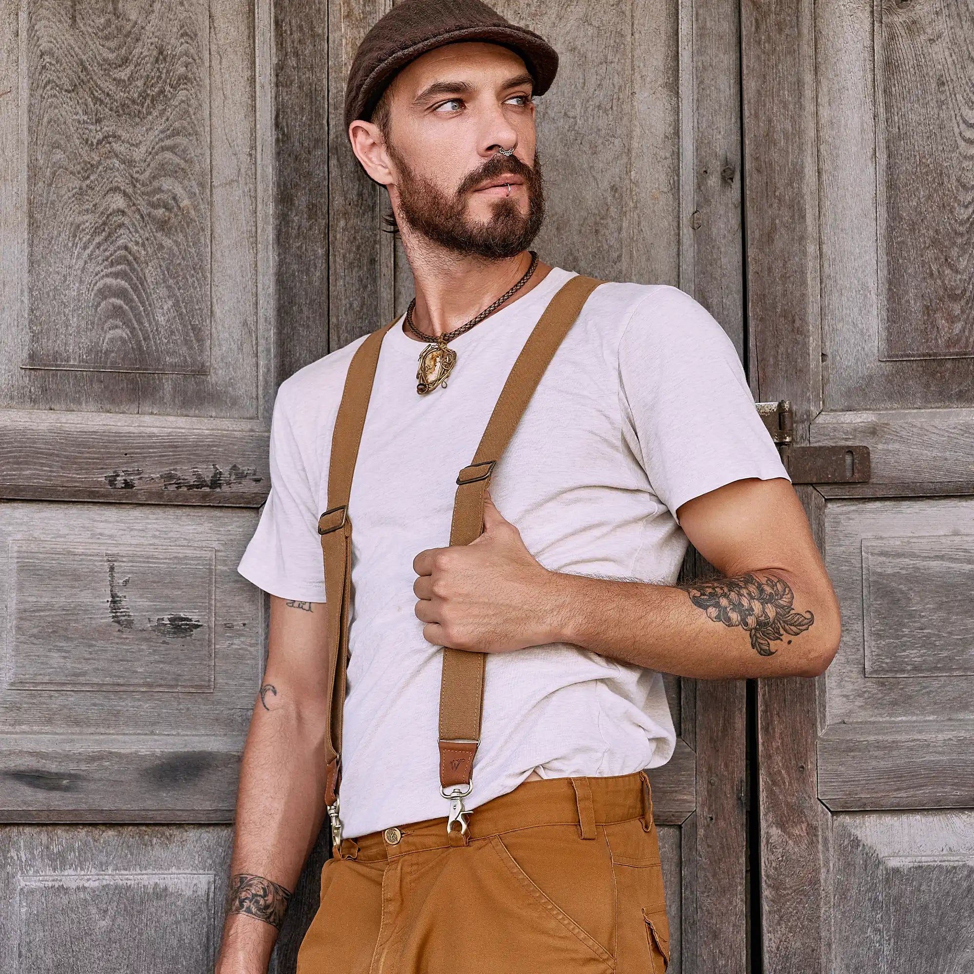 Man posing in a street wearing a flat cap and Wiseguy Original Suspenders